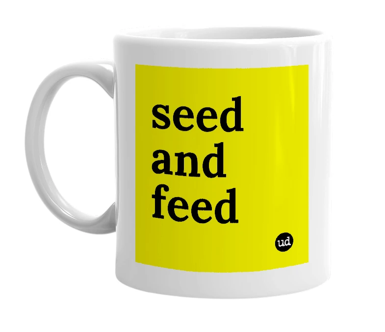 White mug with 'seed and feed' in bold black letters