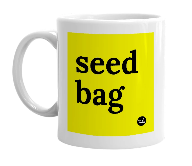 White mug with 'seed bag' in bold black letters