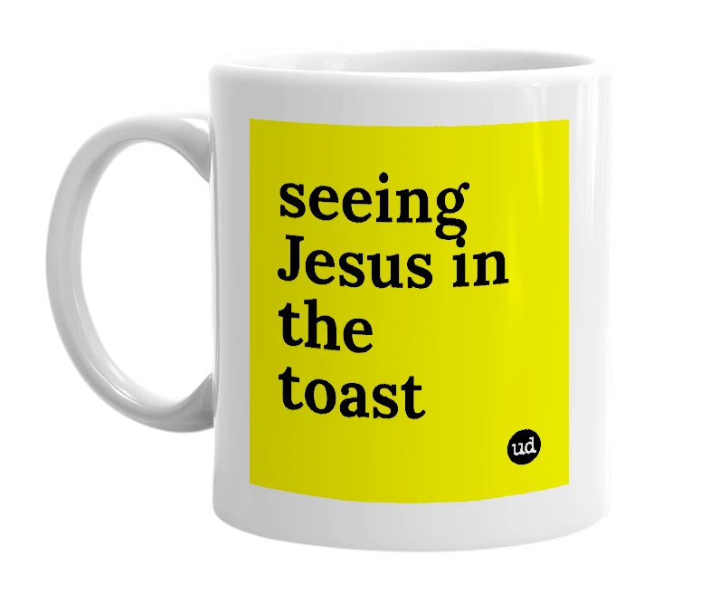 White mug with 'seeing Jesus in the toast' in bold black letters