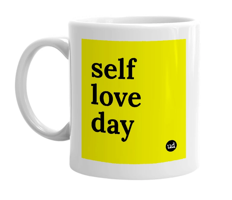 White mug with 'self love day' in bold black letters