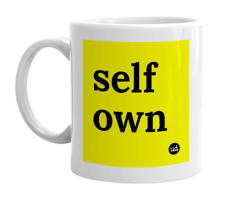 White mug with 'self own' in bold black letters