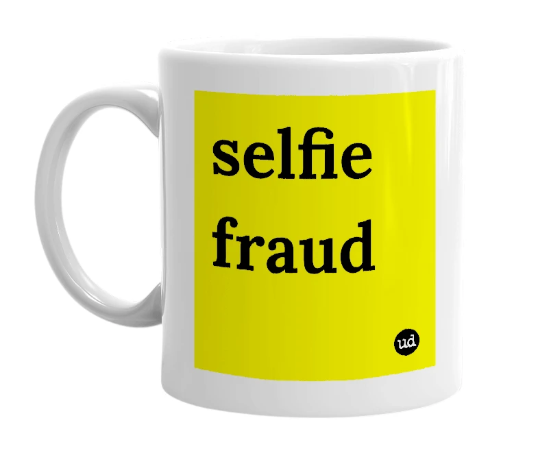White mug with 'selfie fraud' in bold black letters