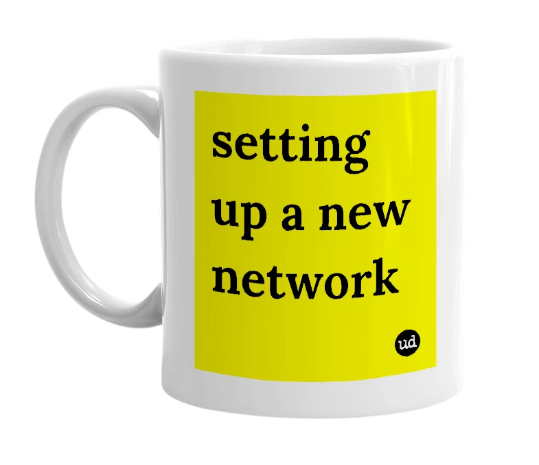 White mug with 'setting up a new network' in bold black letters