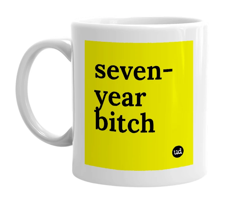 White mug with 'seven-year bitch' in bold black letters