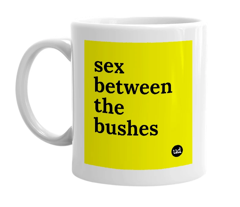 White mug with 'sex between the bushes' in bold black letters