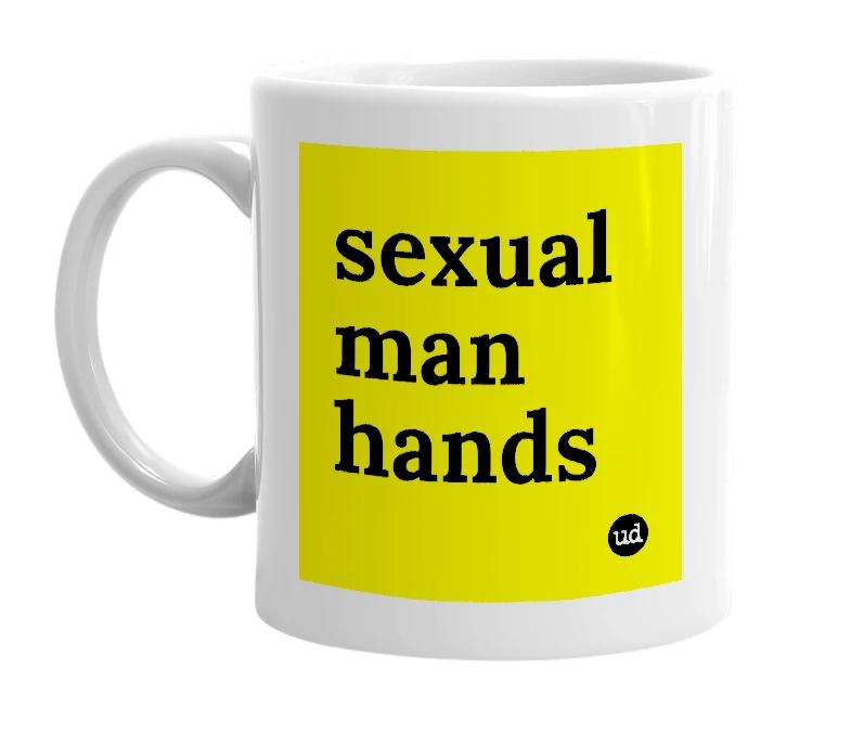 White mug with 'sexual man hands' in bold black letters