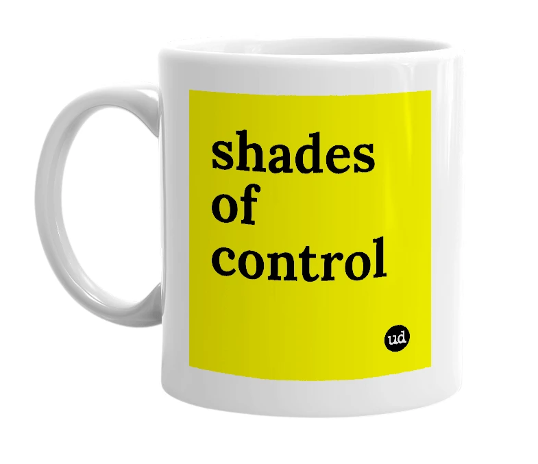 White mug with 'shades of control' in bold black letters