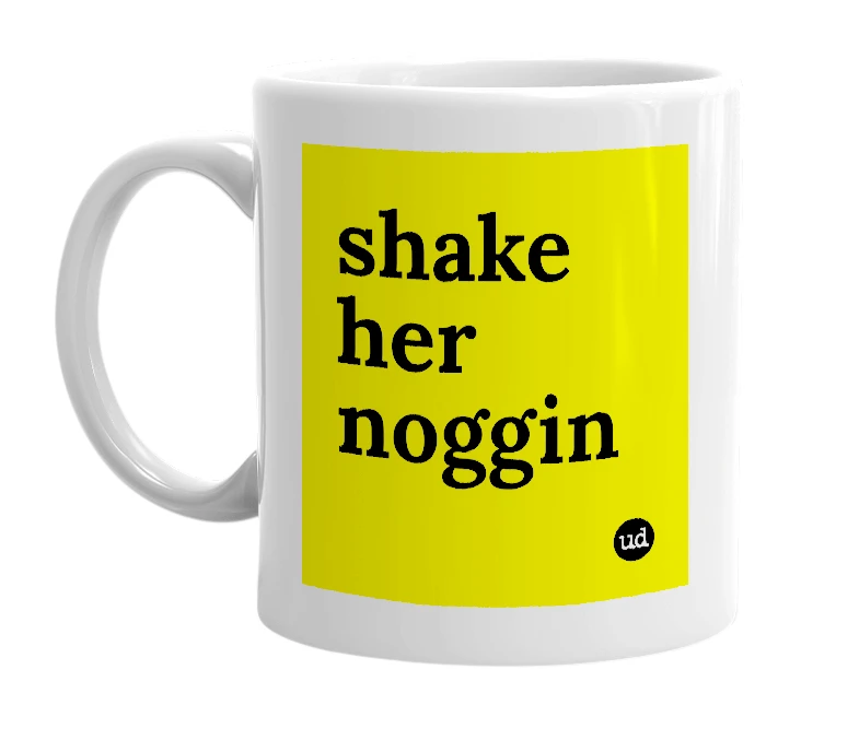 White mug with 'shake her noggin' in bold black letters