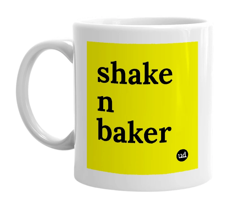 White mug with 'shake n baker' in bold black letters