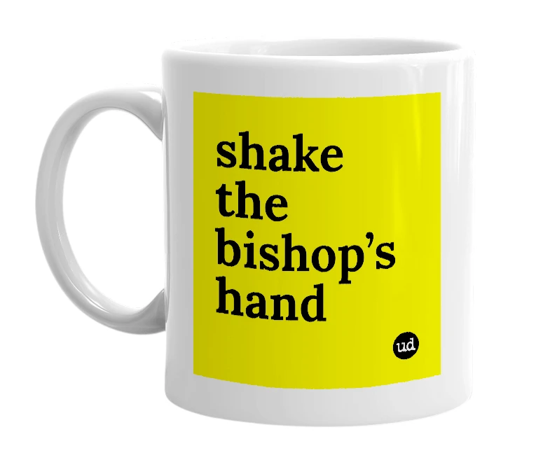 White mug with 'shake the bishop’s hand' in bold black letters