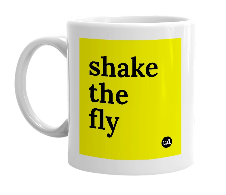 White mug with 'shake the fly' in bold black letters