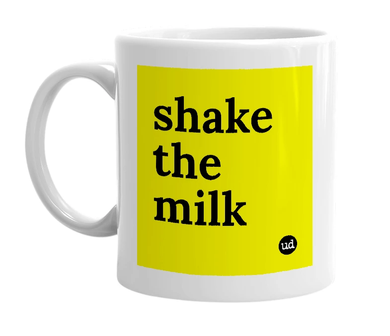 White mug with 'shake the milk' in bold black letters