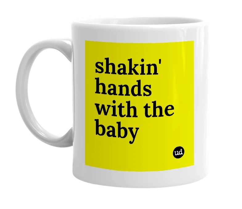 White mug with 'shakin' hands with the baby' in bold black letters