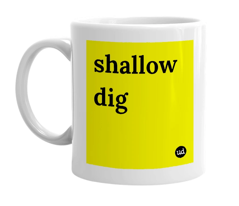 White mug with 'shallow dig' in bold black letters