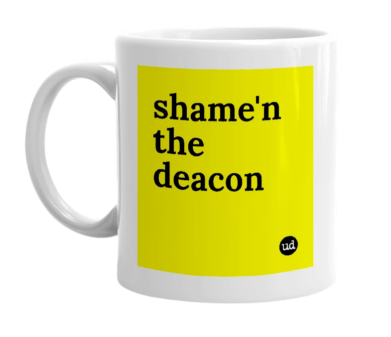 White mug with 'shame'n the deacon' in bold black letters