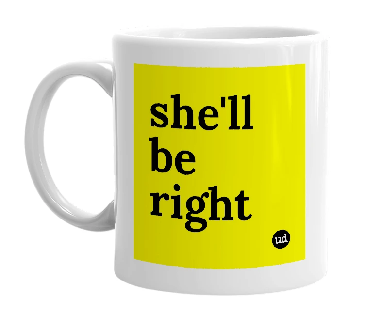 White mug with 'she'll be right' in bold black letters