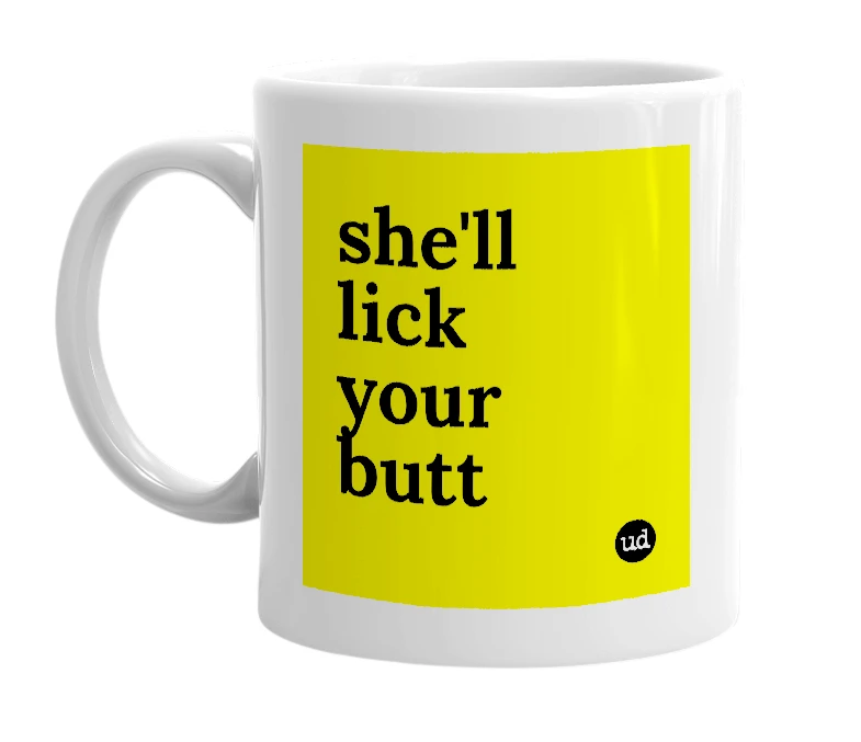 White mug with 'she'll lick your butt' in bold black letters