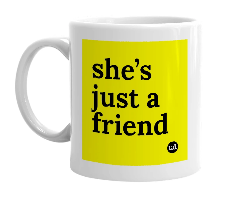 White mug with 'she’s just a friend' in bold black letters