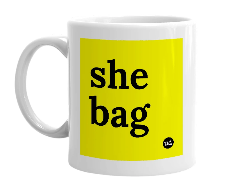 White mug with 'she bag' in bold black letters
