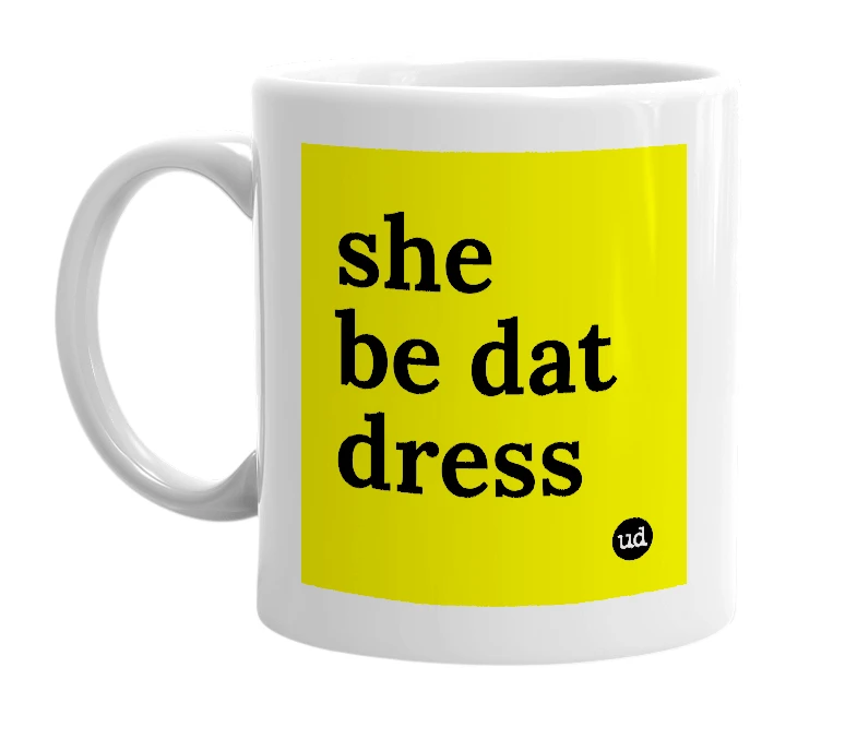 White mug with 'she be dat dress' in bold black letters