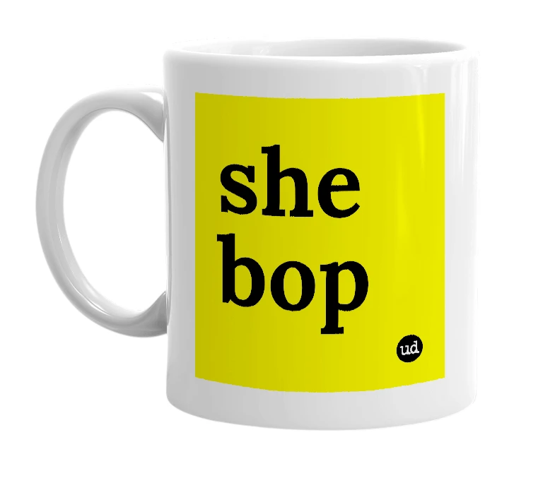 White mug with 'she bop' in bold black letters