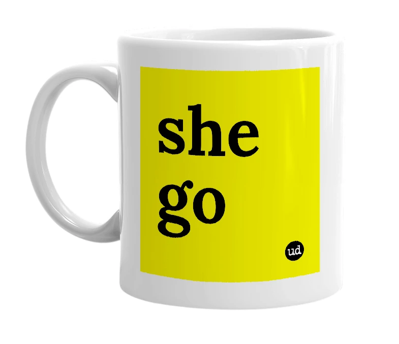 White mug with 'she go' in bold black letters