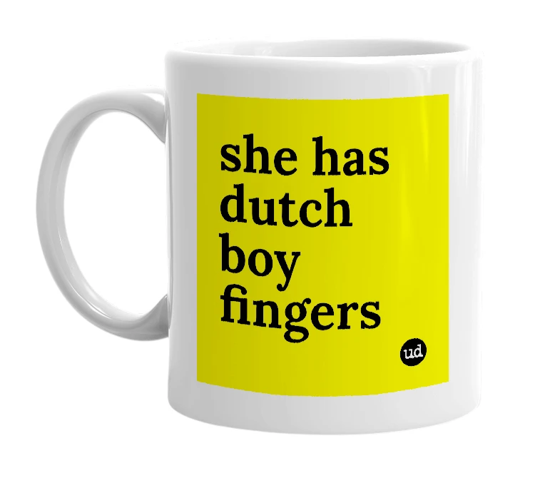 White mug with 'she has dutch boy fingers' in bold black letters