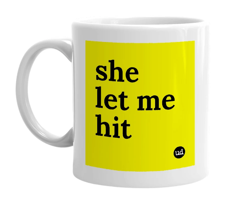 White mug with 'she let me hit' in bold black letters