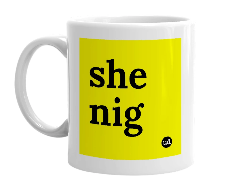 White mug with 'she nig' in bold black letters