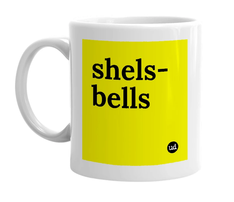 White mug with 'shels-bells' in bold black letters