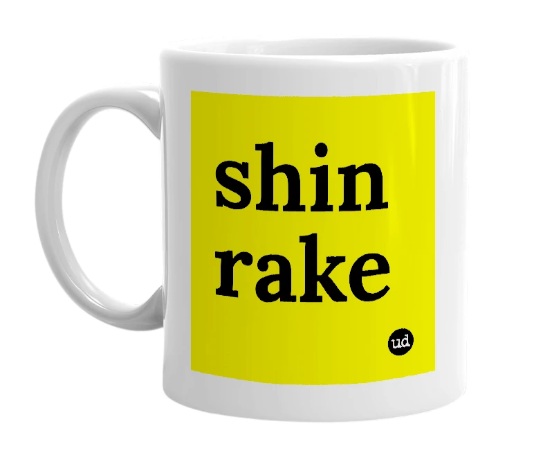 White mug with 'shin rake' in bold black letters