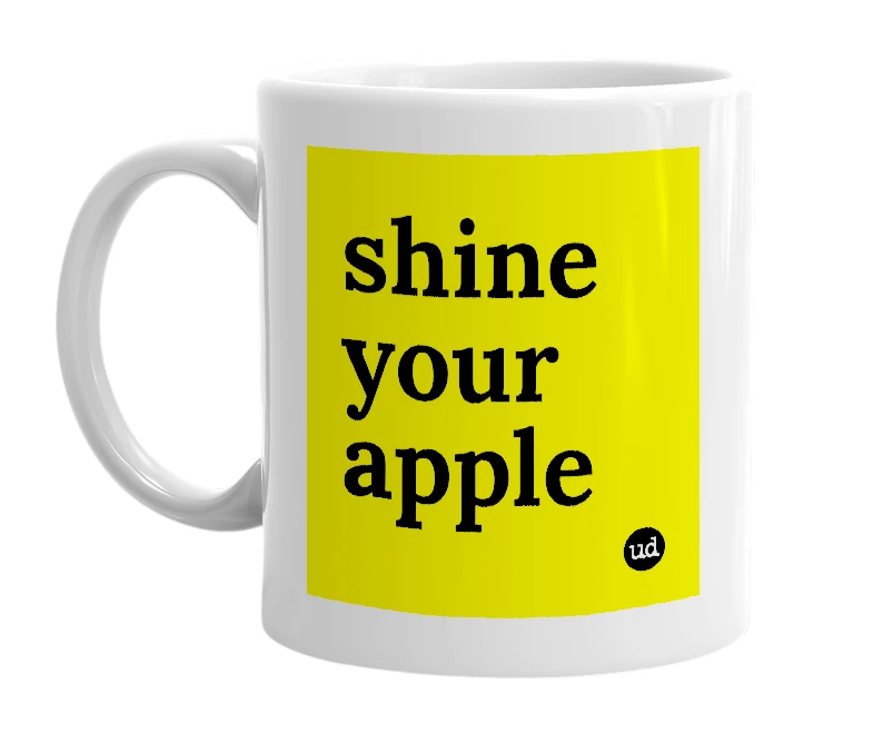 White mug with 'shine your apple' in bold black letters
