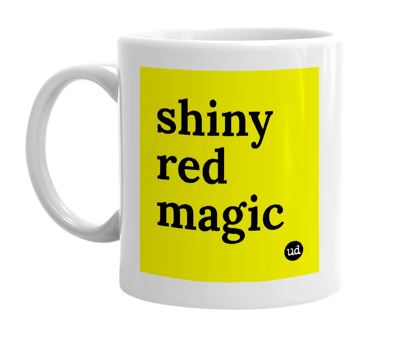 White mug with 'shiny red magic' in bold black letters