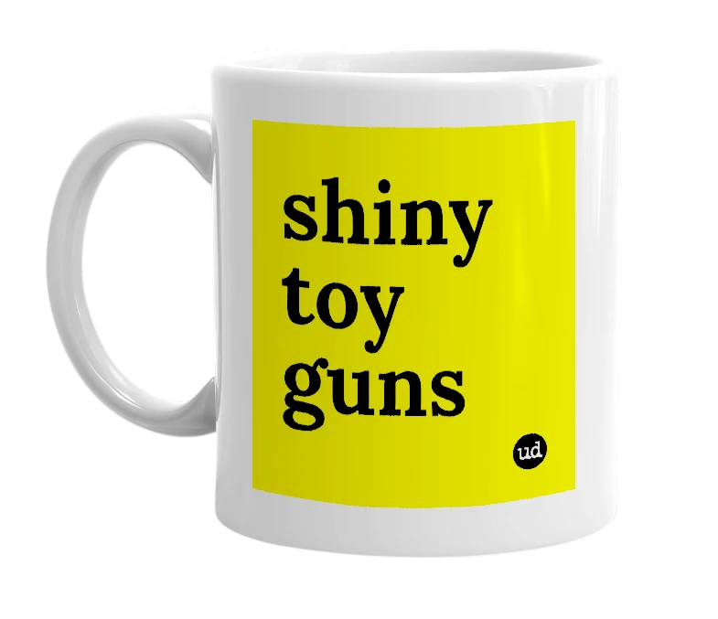 White mug with 'shiny toy guns' in bold black letters