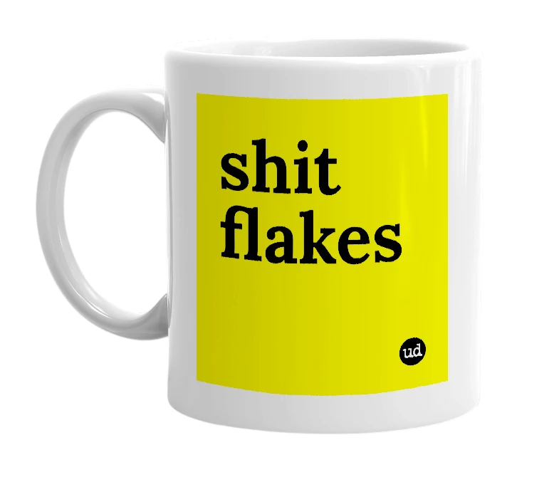 White mug with 'shit flakes' in bold black letters