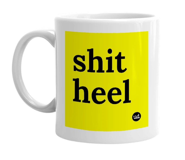 White mug with 'shit heel' in bold black letters