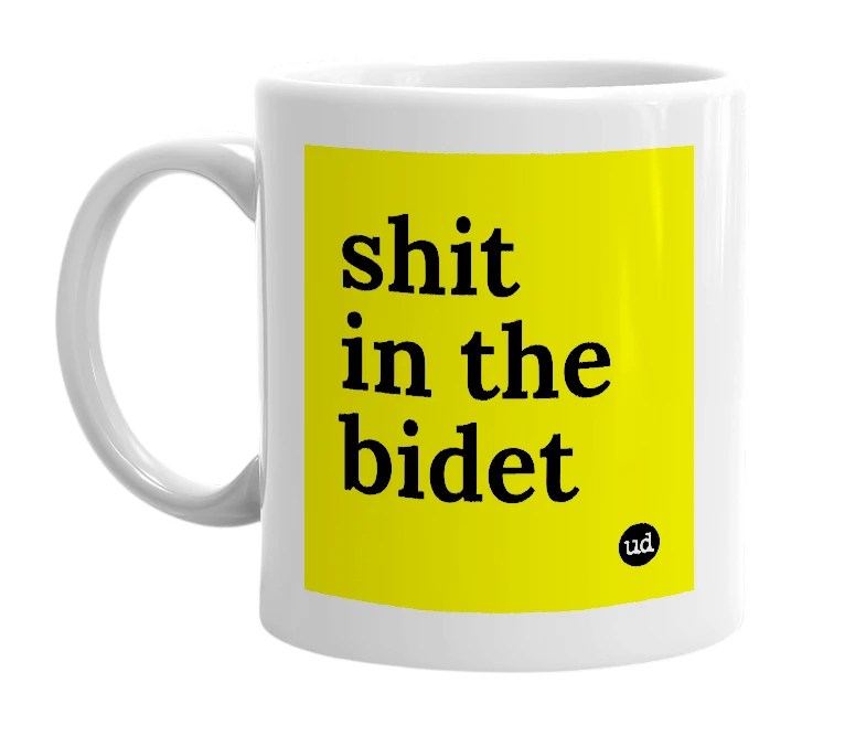 White mug with 'shit in the bidet' in bold black letters