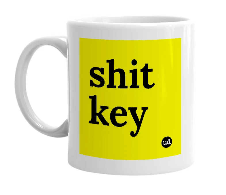 White mug with 'shit key' in bold black letters