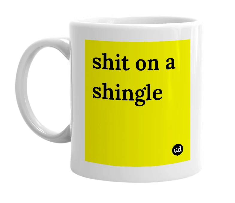 White mug with 'shit on a shingle' in bold black letters