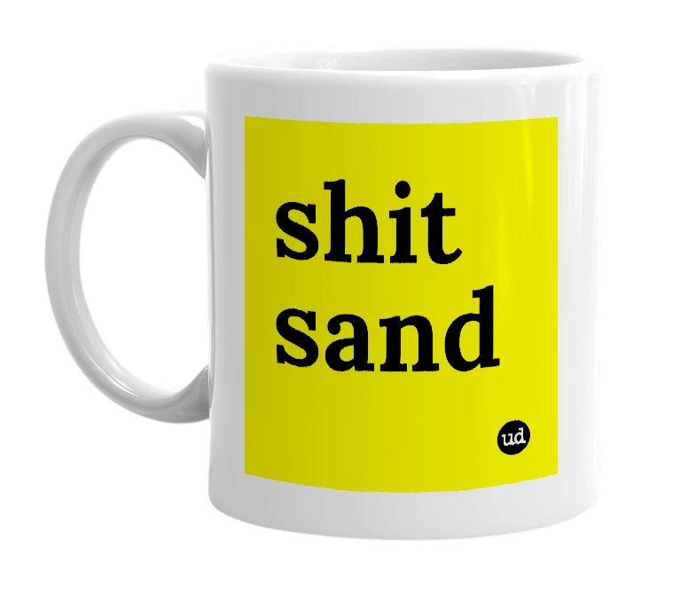 White mug with 'shit sand' in bold black letters
