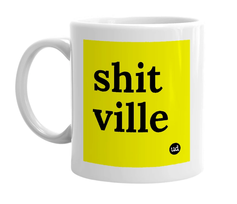 White mug with 'shit ville' in bold black letters