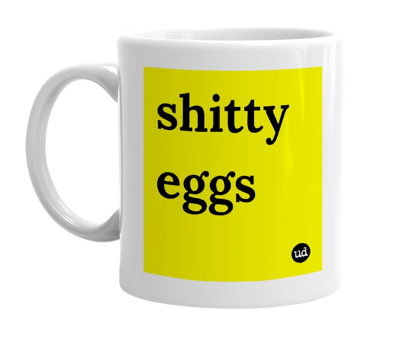 White mug with 'shitty eggs' in bold black letters