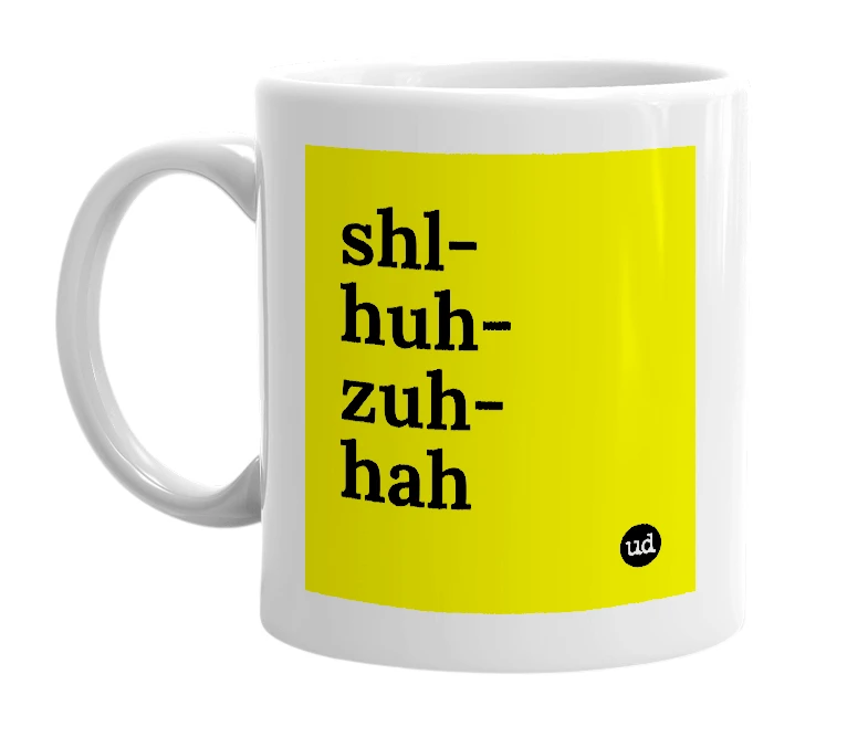 White mug with 'shl-huh-zuh-hah' in bold black letters