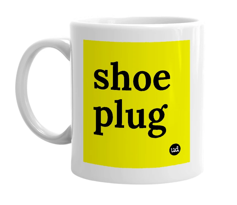 White mug with 'shoe plug' in bold black letters