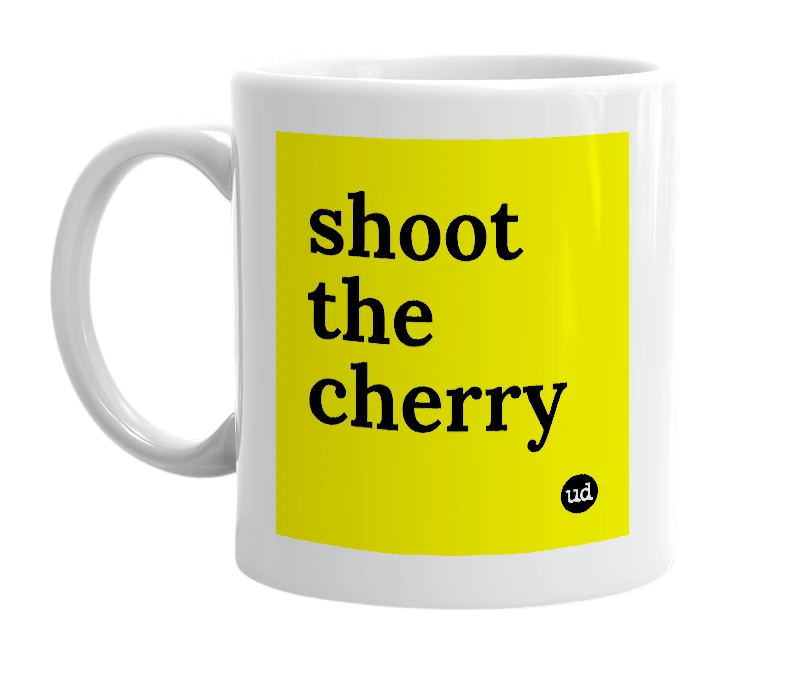 White mug with 'shoot the cherry' in bold black letters