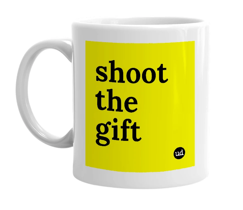 White mug with 'shoot the gift' in bold black letters