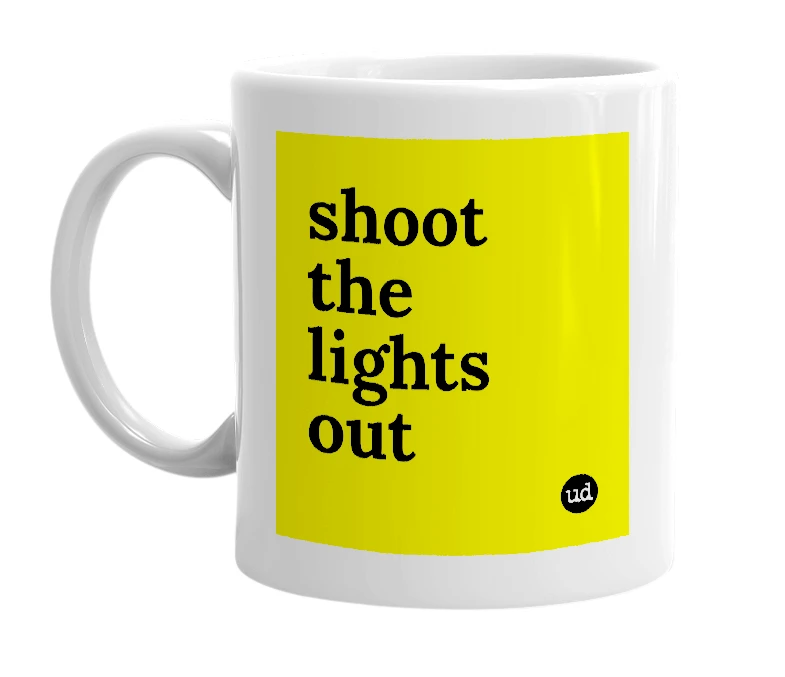 White mug with 'shoot the lights out' in bold black letters