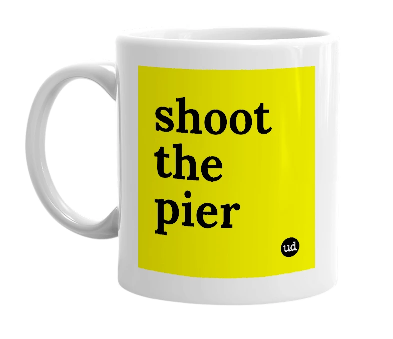 White mug with 'shoot the pier' in bold black letters