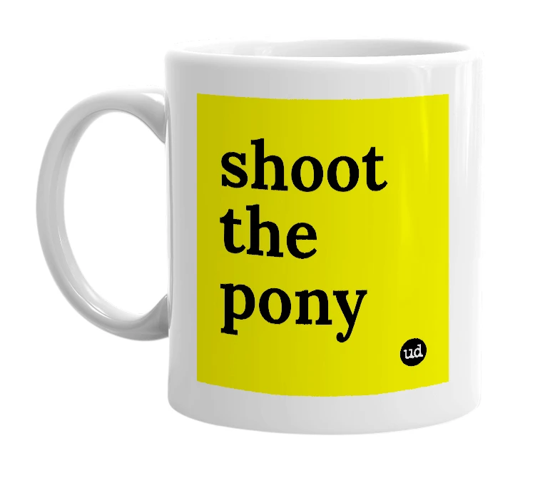 White mug with 'shoot the pony' in bold black letters