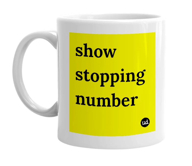 White mug with 'show stopping number' in bold black letters
